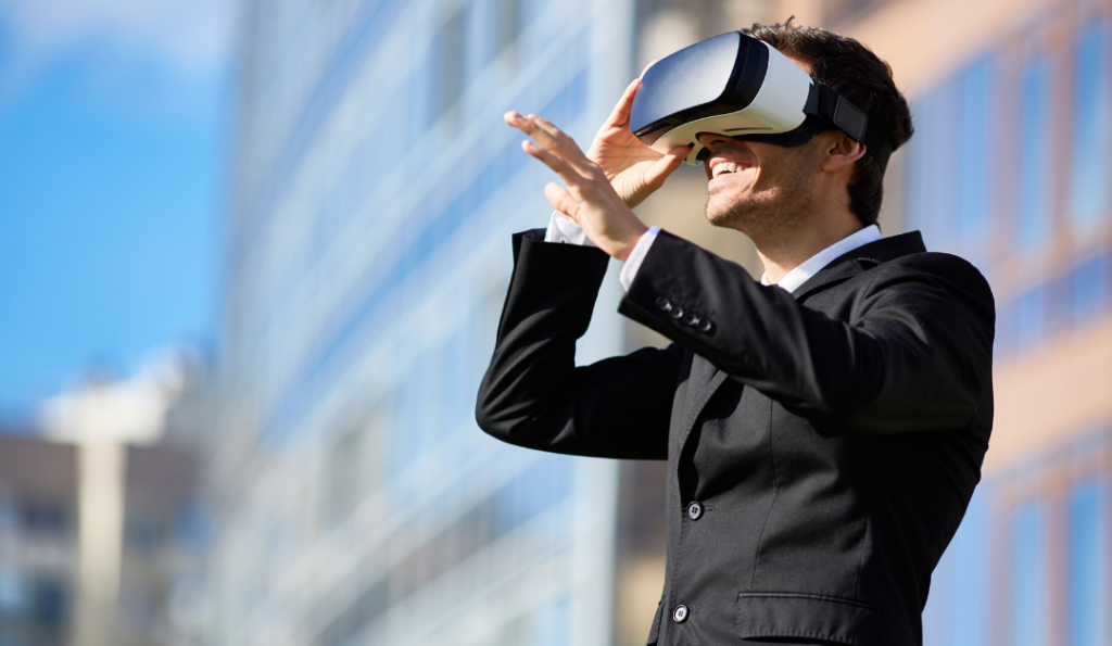 Man standing outside with VR glasses on.
