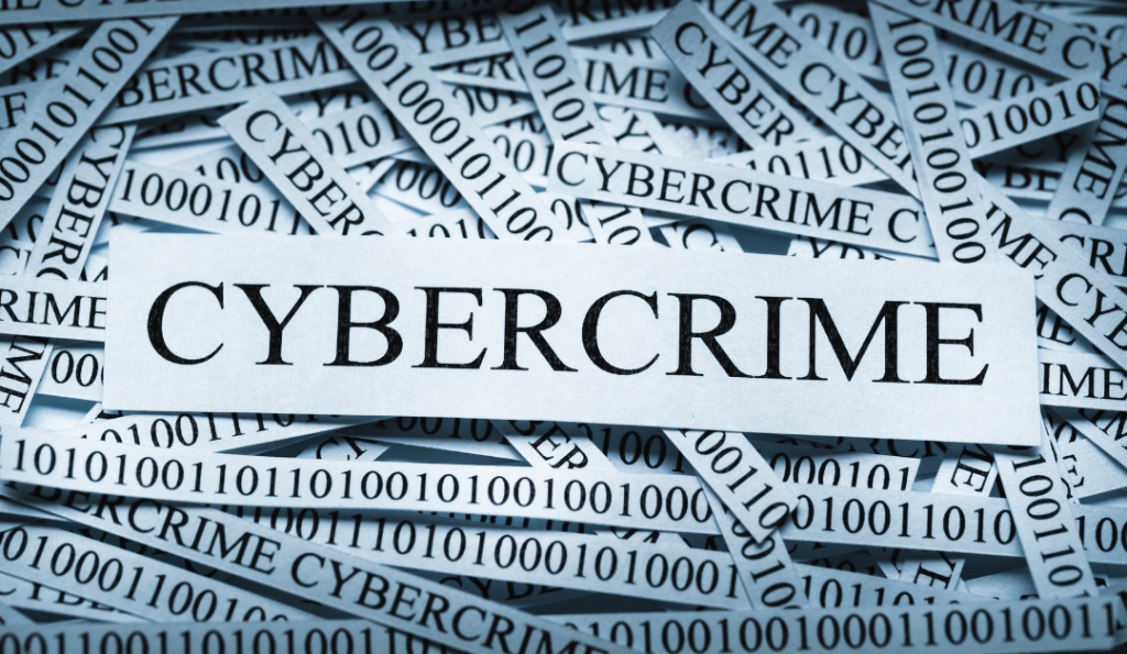 Strings of paper containing the numbers 0 and 1 and the word cybercrime.